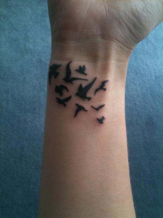 Określ wartość tatuażu. Ptak jako symbol wolności